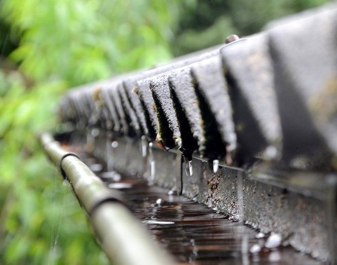Seamless rain gutters on a house