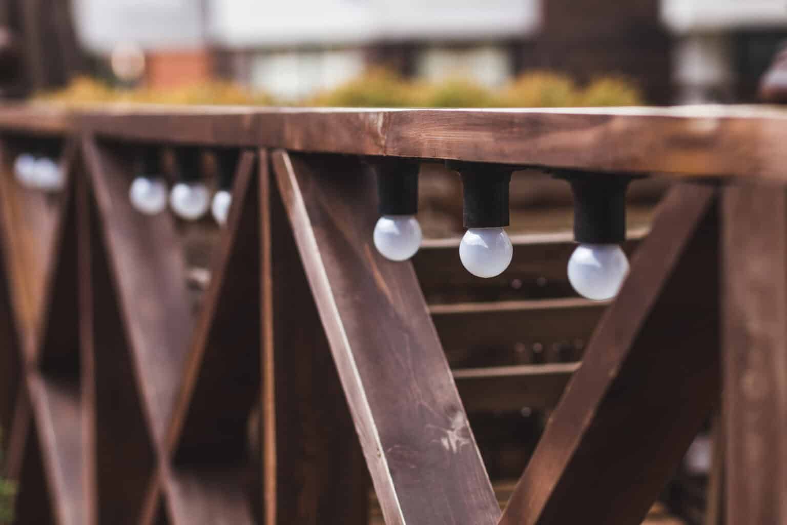 Wooden fence with string lights.