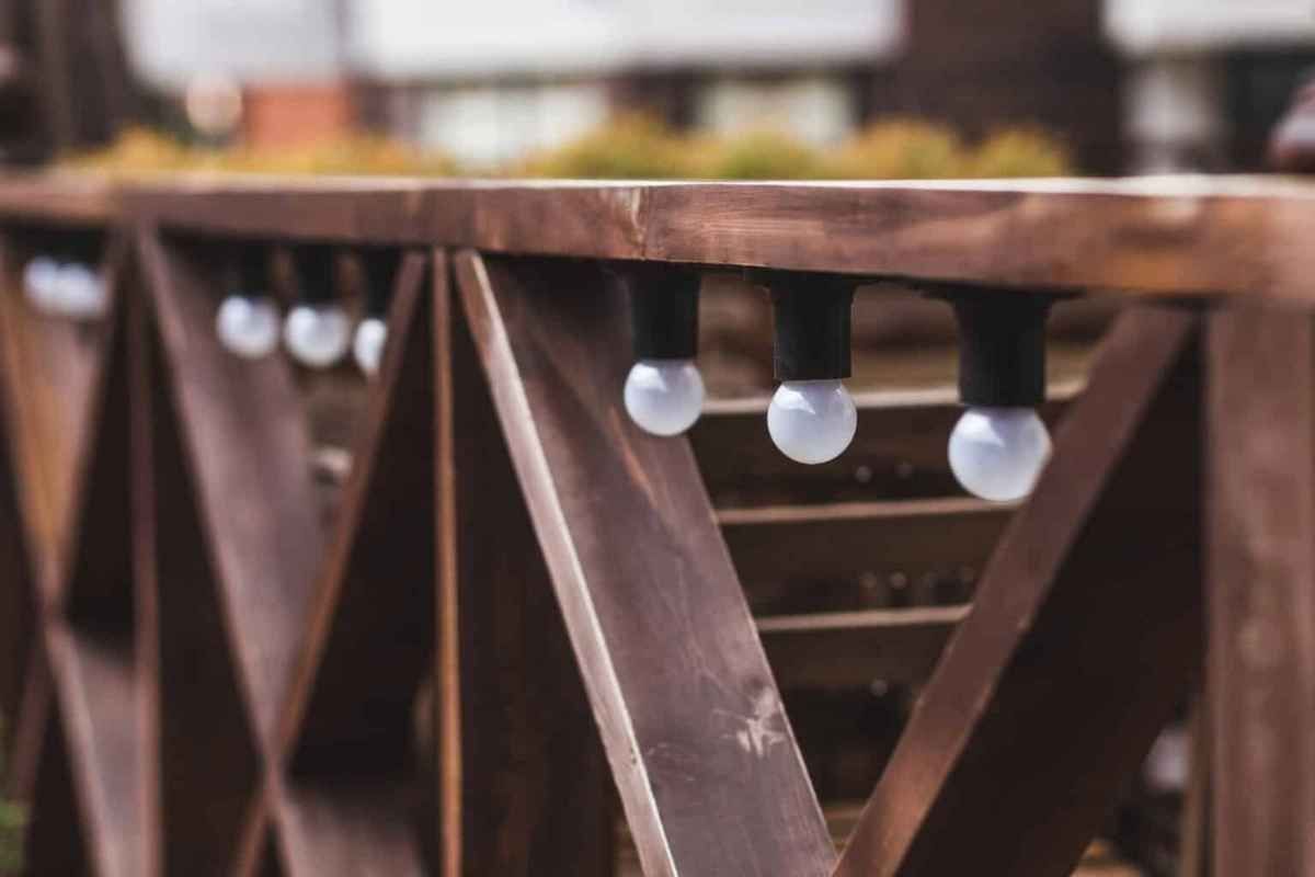 Wooden fence with string lights.