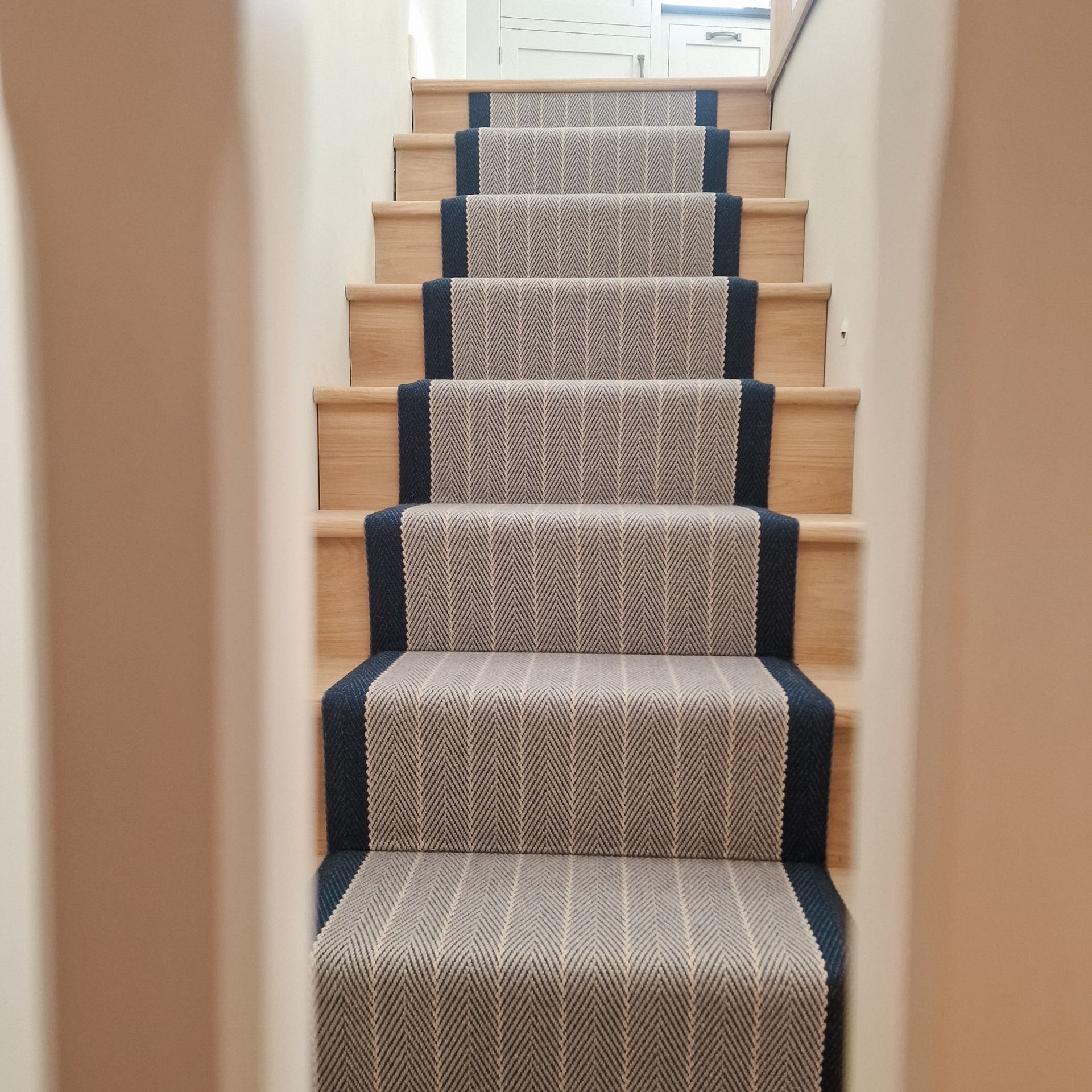 Roger Oates Dart Midnight stair runner on wooden stairs in South Hams