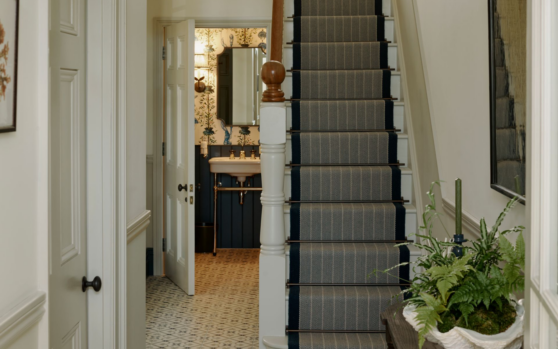 Roger Oates stair runner installed on wooden stairs