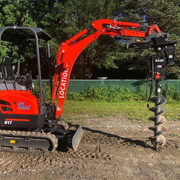 Une excavatrice avec le mot « location » dessus