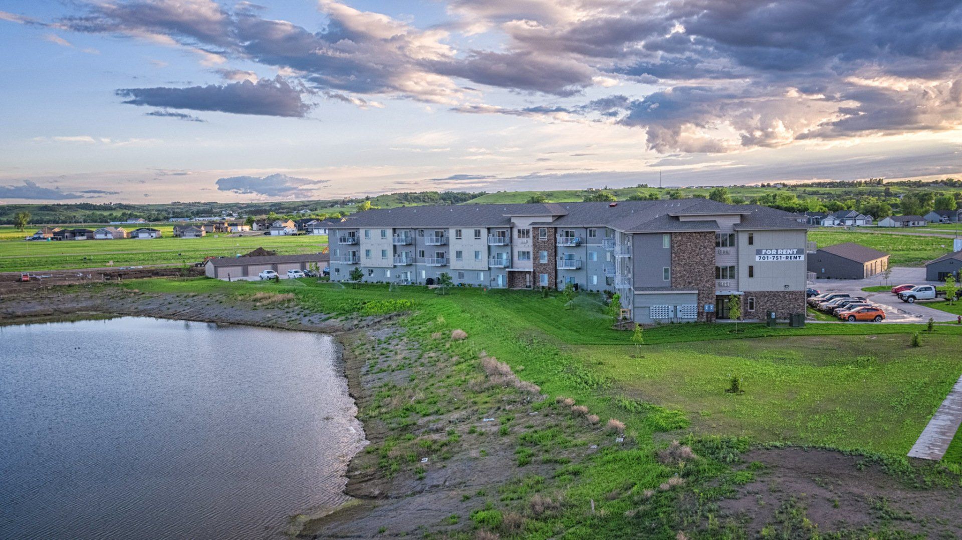Alternate aerial drone view of Dwell Apartments with waterfront view