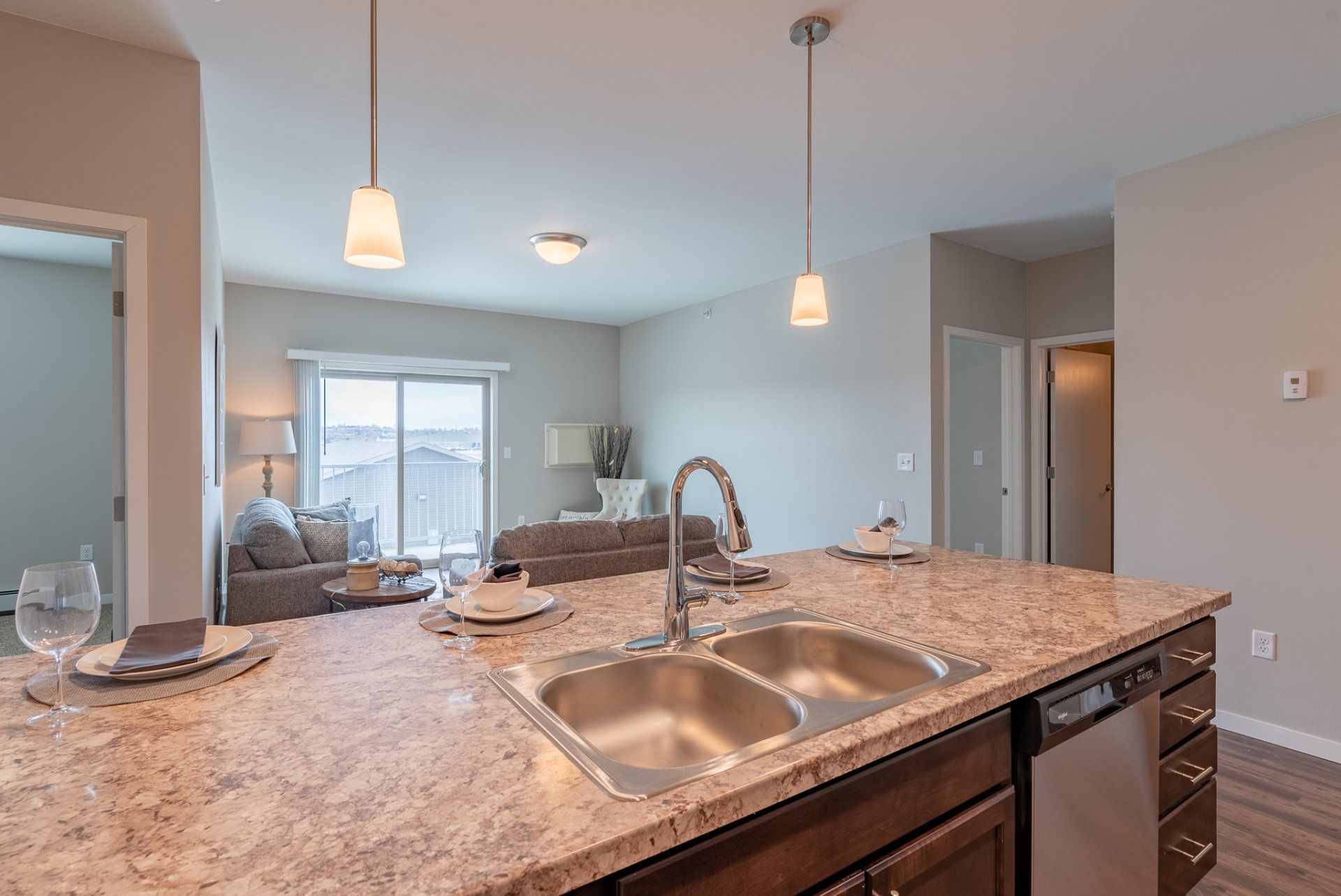 Kitchen island with granite countertops and stainless steel sink