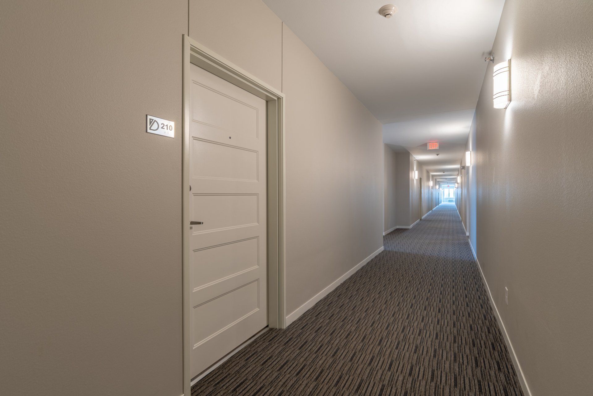 Apartment building hallway with door leading to apartment