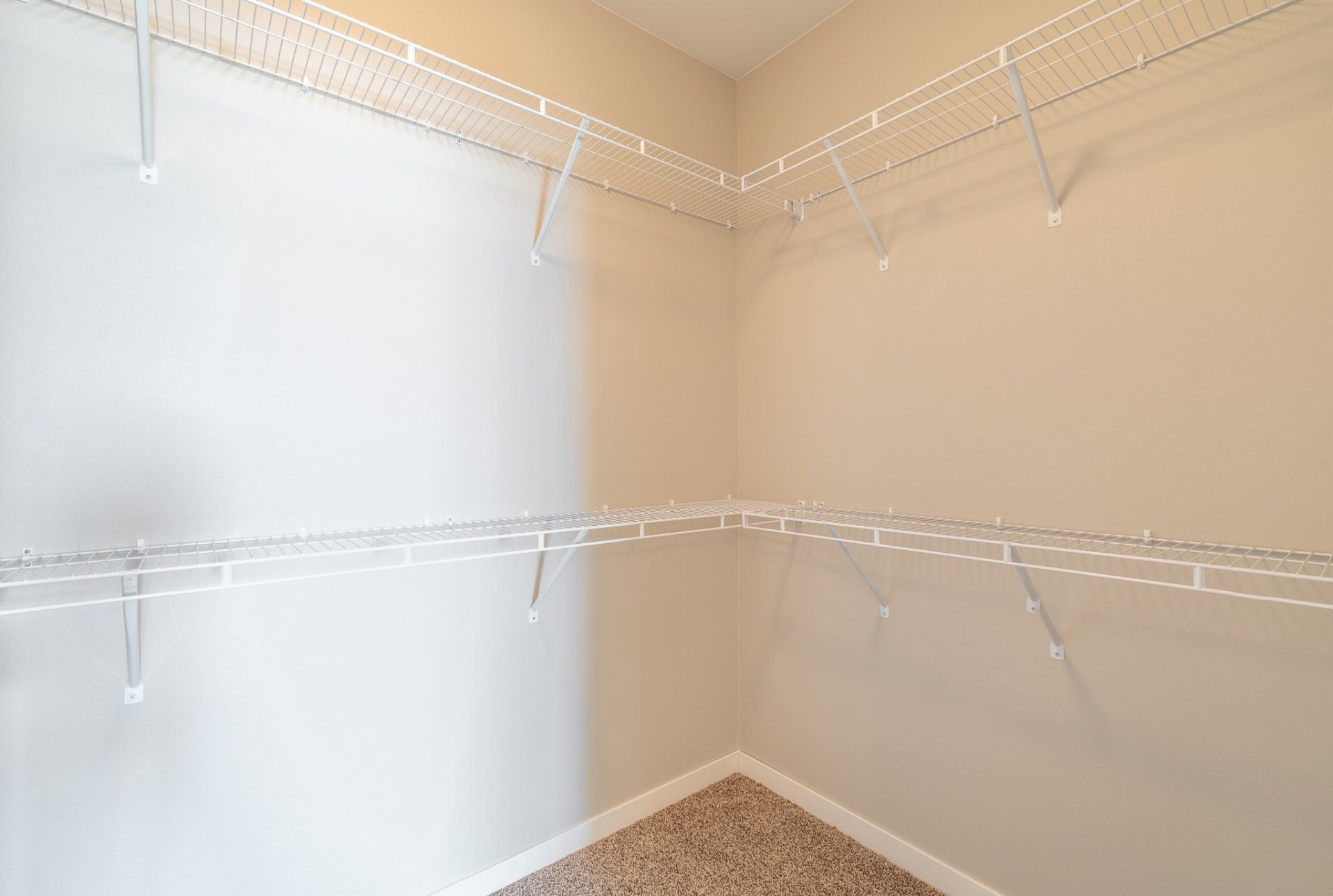 Large walk in closet with shelf spaces