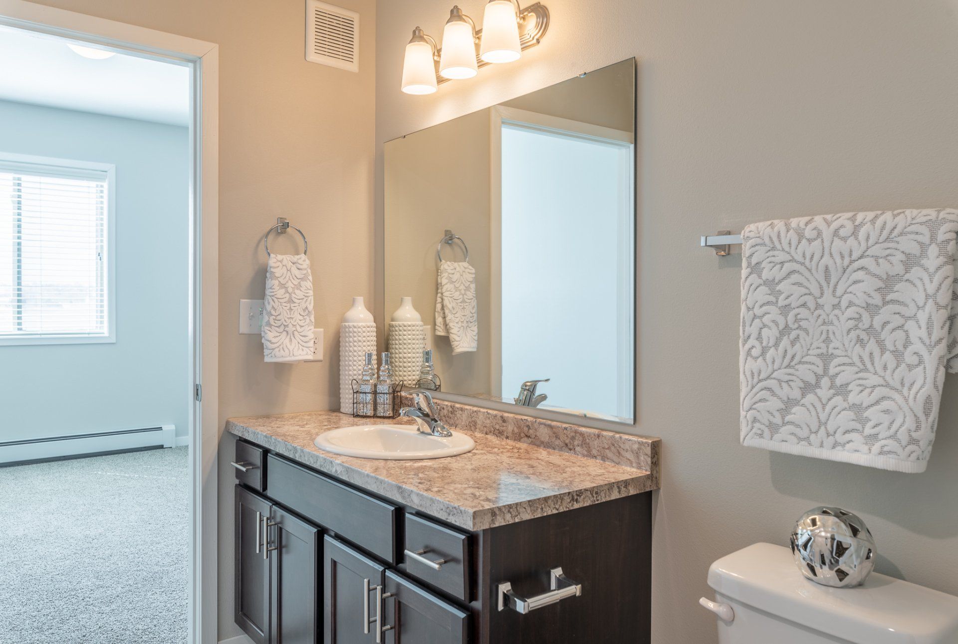 Alternate view of bathroom with granite counters, tub shower combo