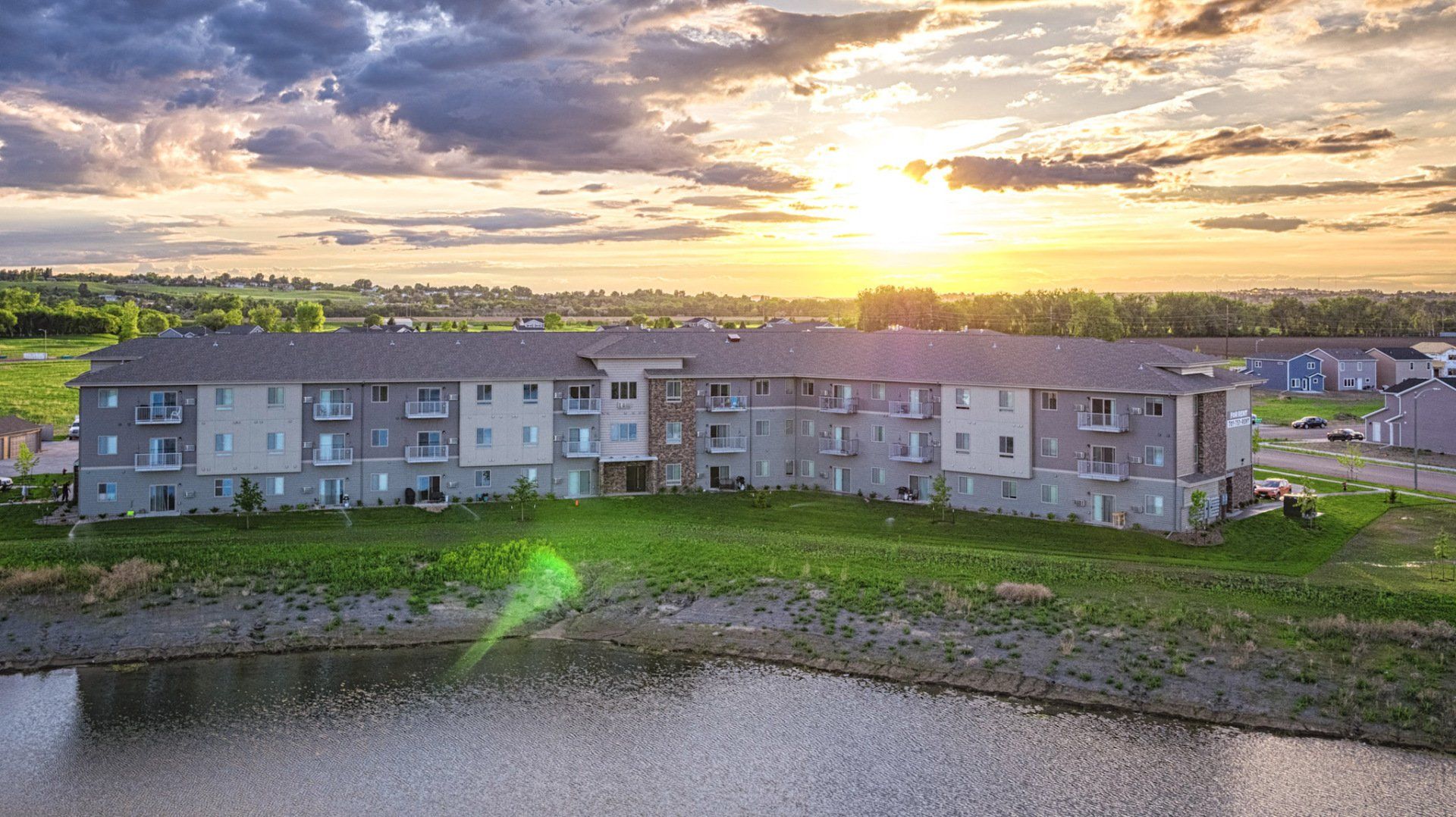 Aerial drone view of Dwell Apartments with waterfront view