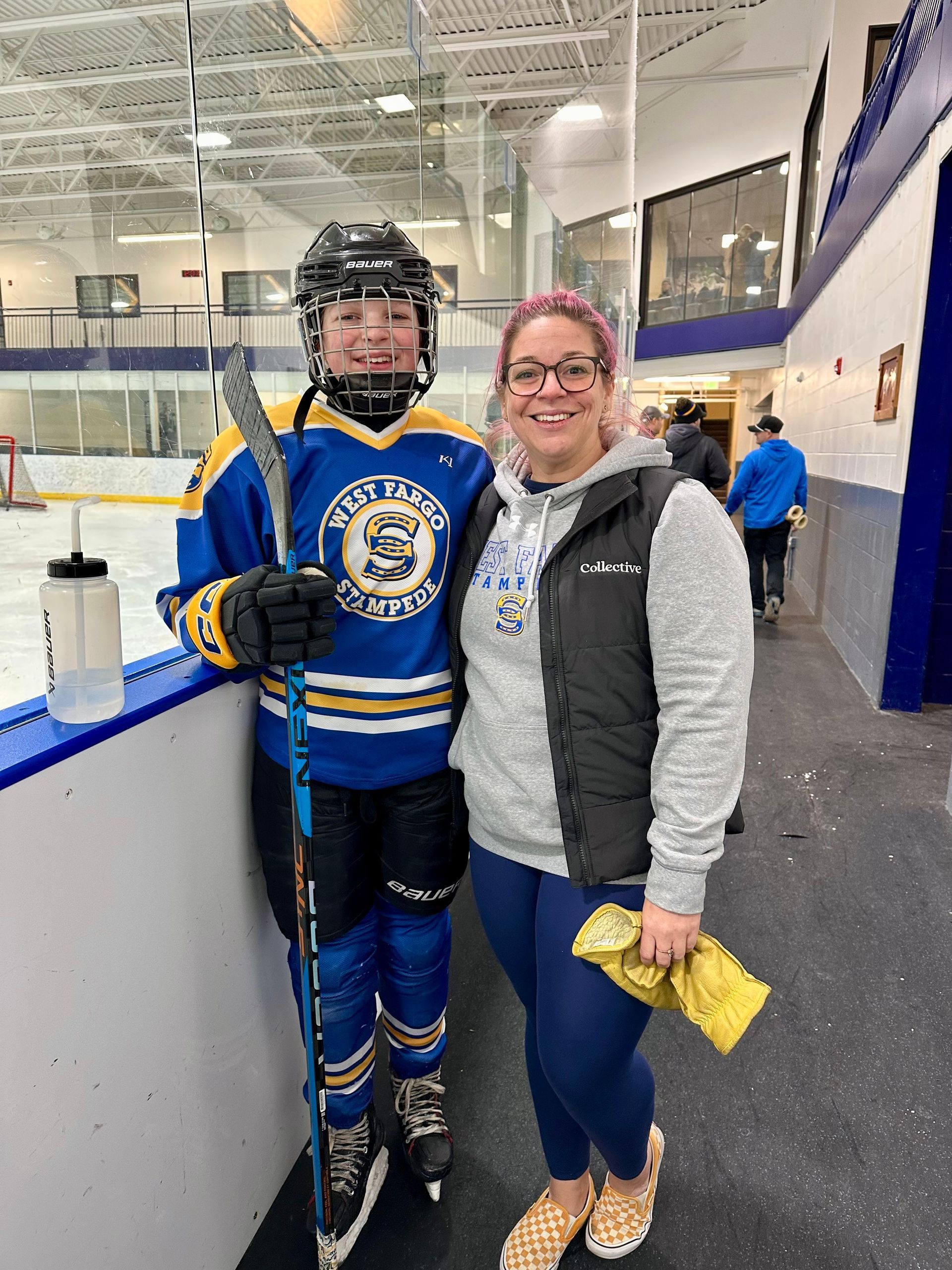 Kayla with her daughter Aurora, who plays hockey for West Fargo