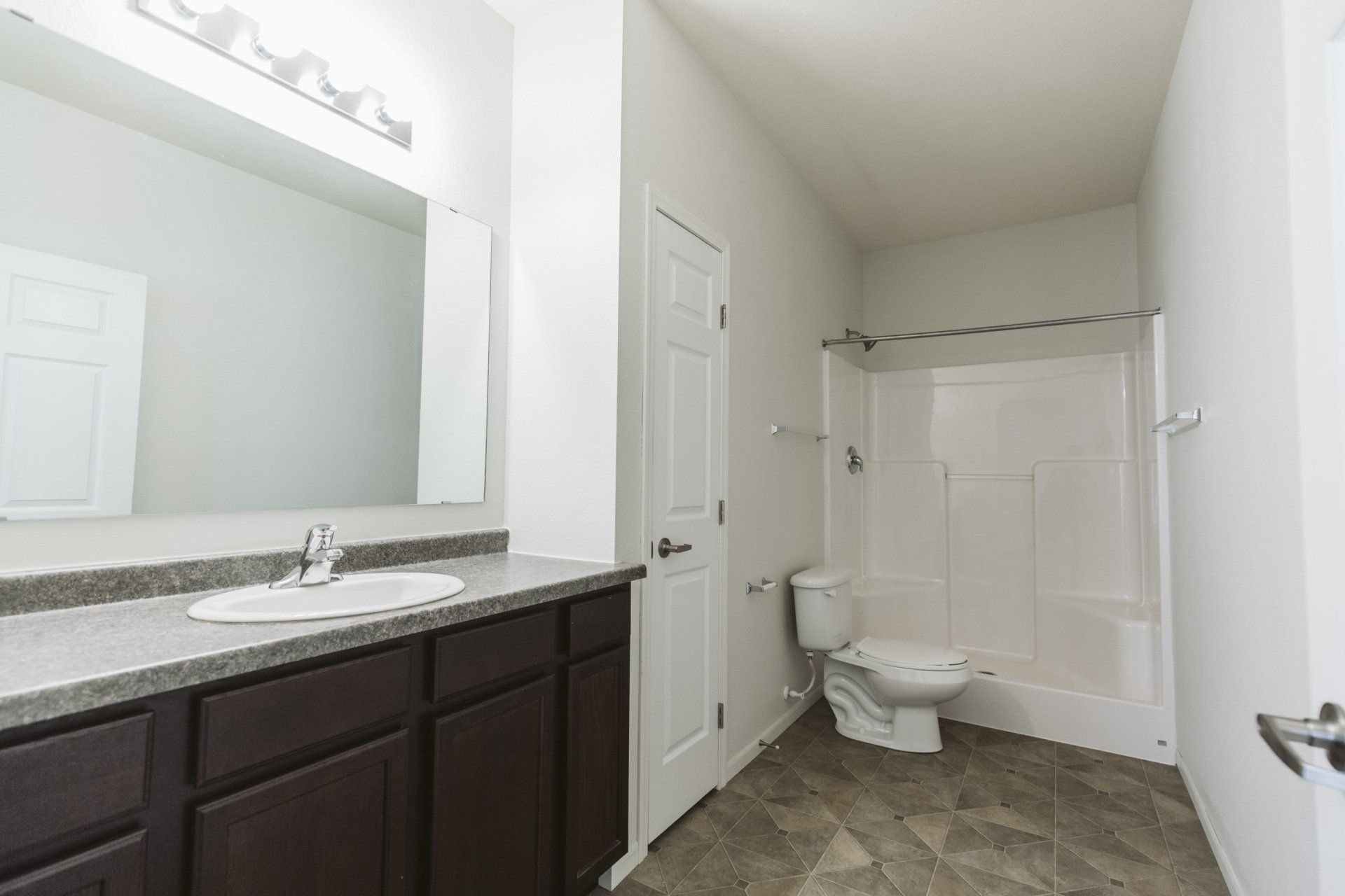 Bathroom with vanity mirror, shower tub combo