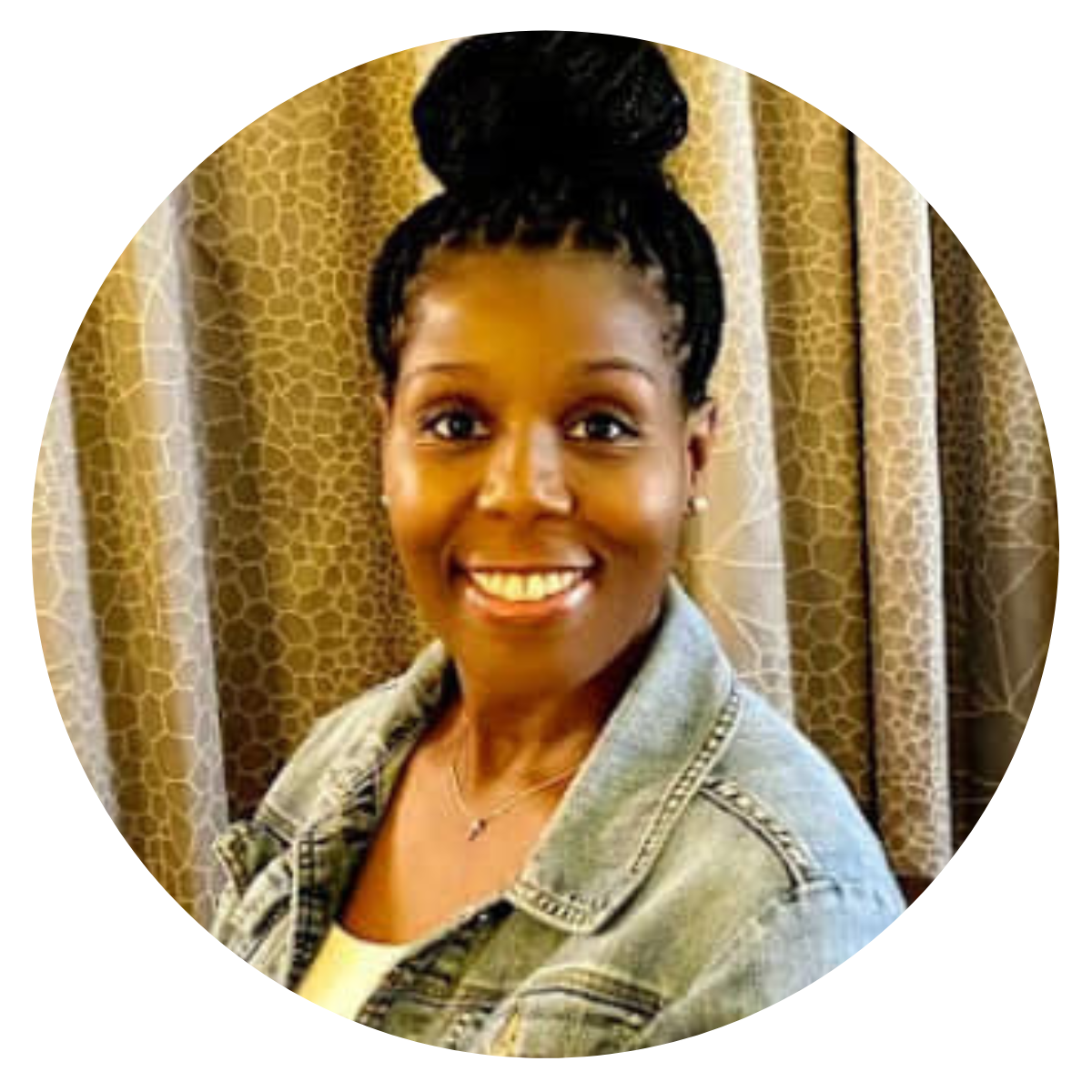a woman in a denim jacket is smiling in a circle .