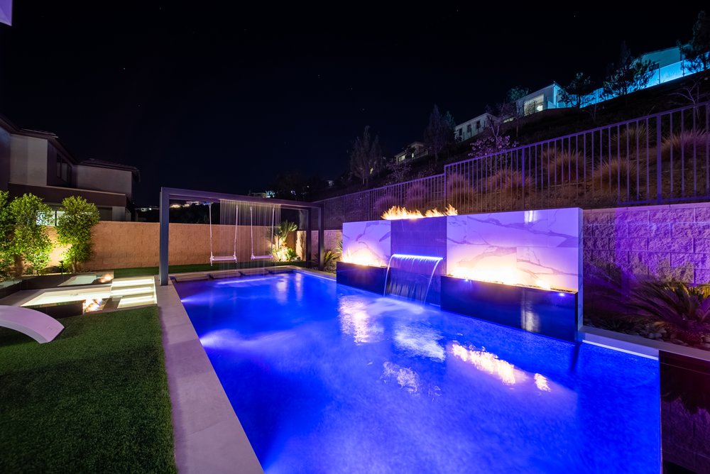 San Juan Capistrano Pool Builder - Custom pool with swing, fire features, and water feature. San Juan Capistrano Pool Builder - Custom pool with swing, fire features, and water feature.