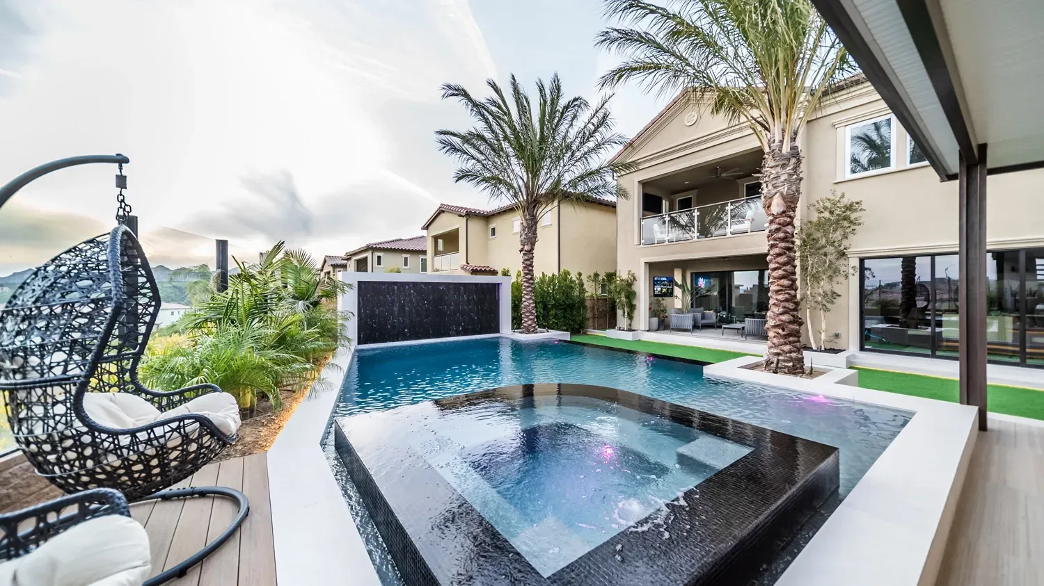 Luxury swimming pool and tile spa in large backyard and outdoor living space. Luxury swimming pool and tile spa in large backyard and outdoor living space.