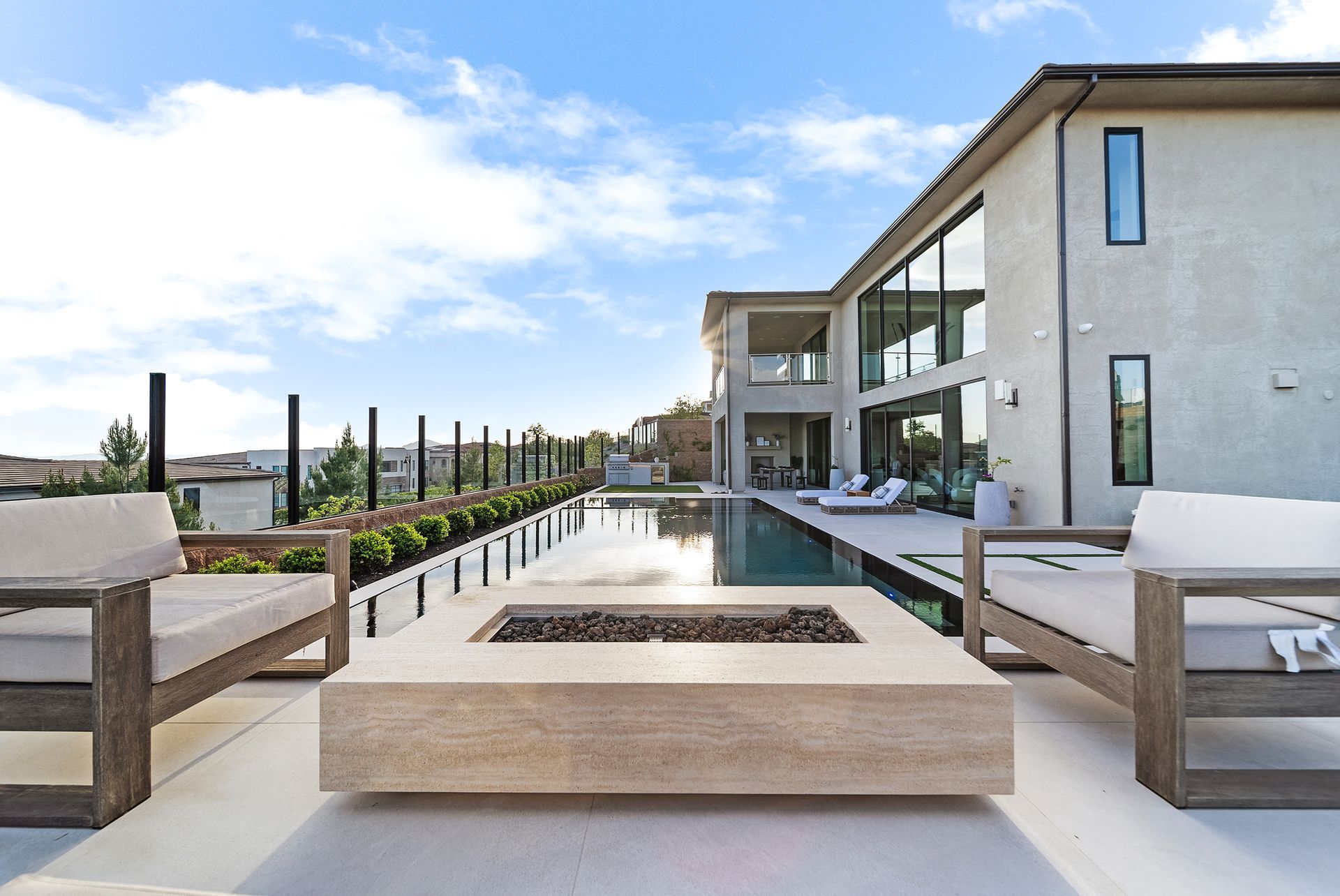 Luxury pool design and construction in Porter Ranch, Los Angeles. Design and build by Westmod. Day time photo of completed custom pool and outdoor living space.