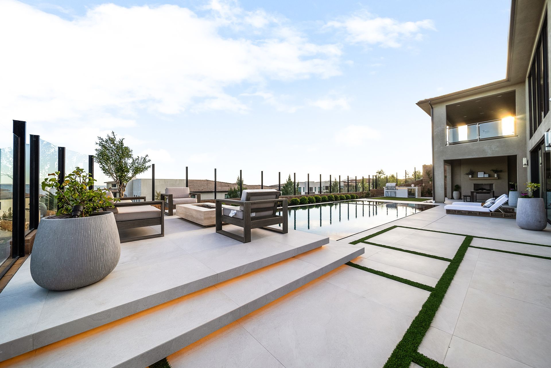 Luxury pool design and construction in Porter Ranch, Los Angeles. Design and build by Westmod. Day time photo of completed custom pool and outdoor living space.