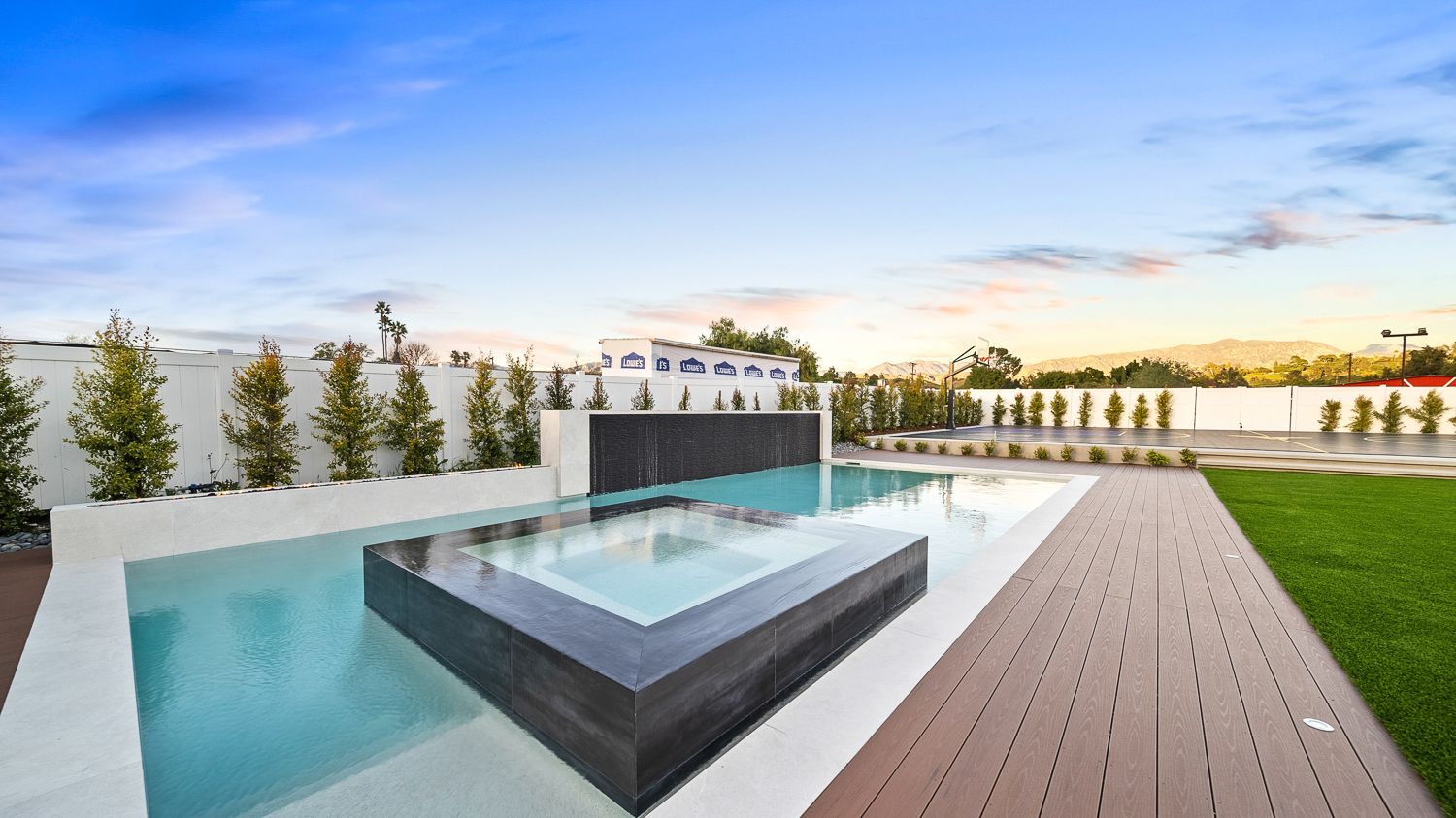 Custom pool and outdoor living project complete with a full court basketball court and outdoor kitchen. Project by Westmod. Location = Santa Clarita, CA. Custom pool and outdoor living project complete with a full court basketball court and outdoor kitchen. Project by Westmod. Location = Santa Clarita, CA.