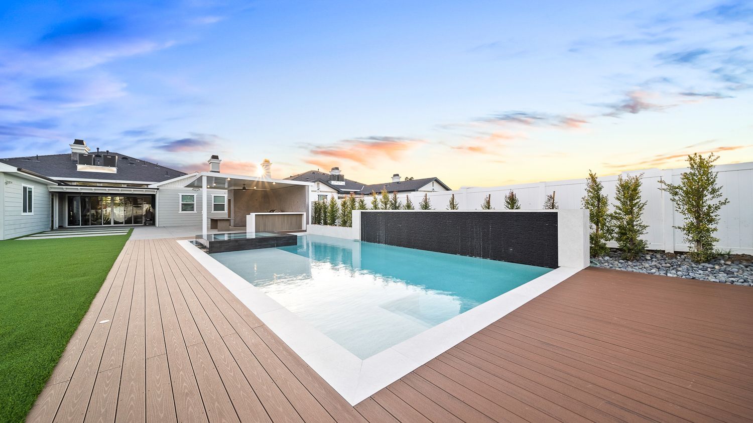 Custom pool and outdoor living project complete with a full court basketball court and outdoor kitchen. Project by Westmod. Location = Santa Clarita, CA.