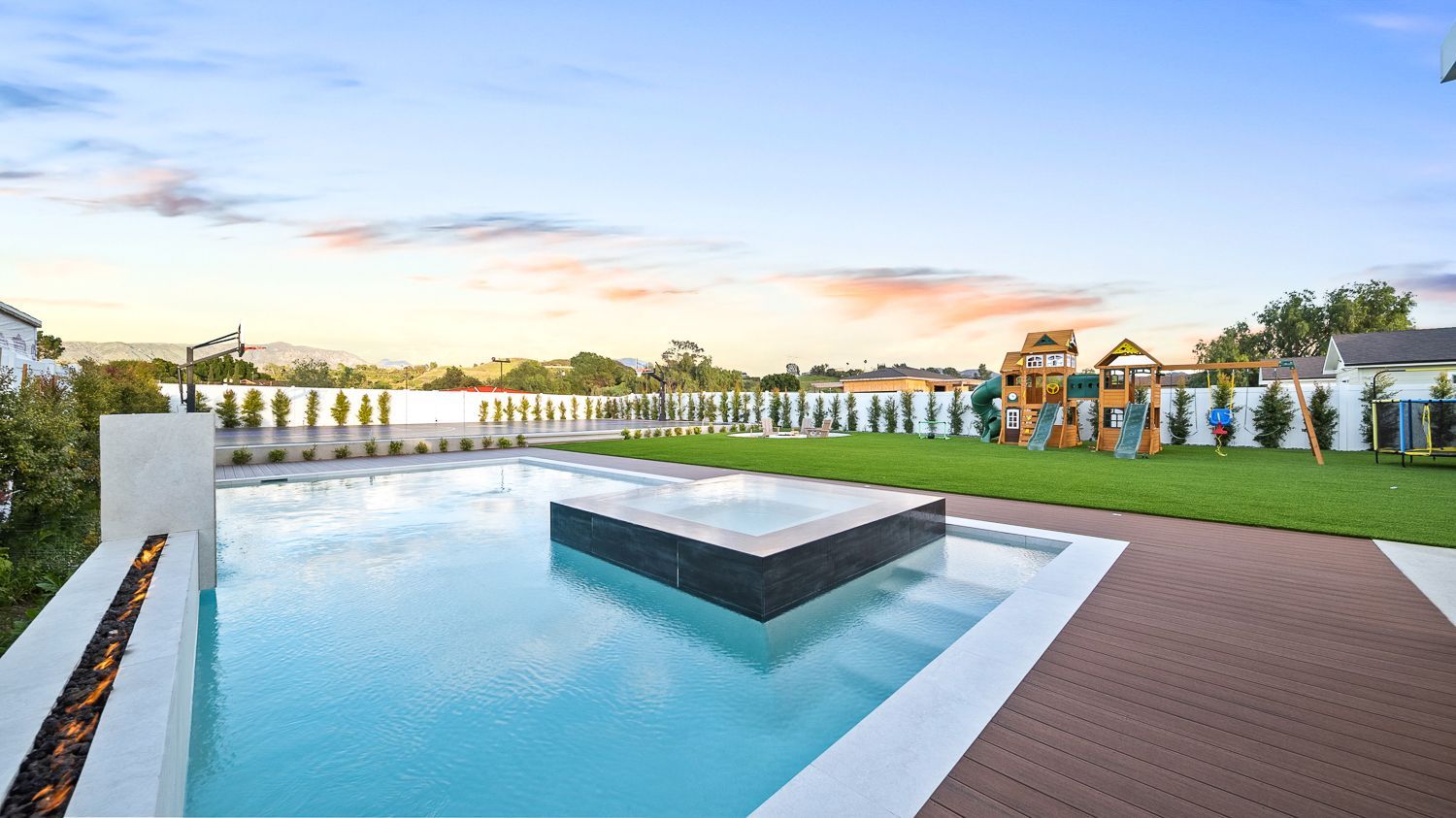 Custom pool and outdoor living project complete with a full court basketball court and outdoor kitchen. Project by Westmod. Location = Santa Clarita, CA.
