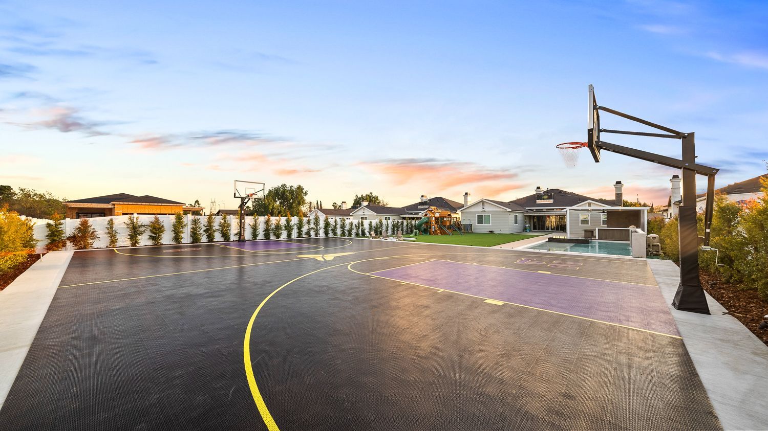 Custom pool and outdoor living project complete with a full court basketball court and outdoor kitchen. Project by Westmod. Location = Santa Clarita, CA.
