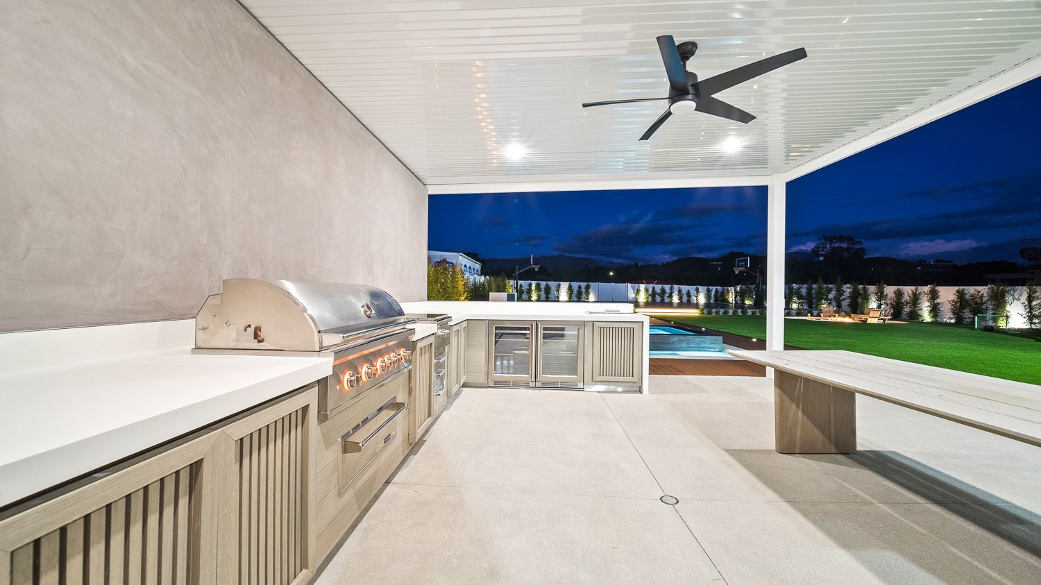 Custom pool and outdoor living project complete with a full court basketball court and outdoor kitchen. Project by Westmod. Location = Santa Clarita, CA.