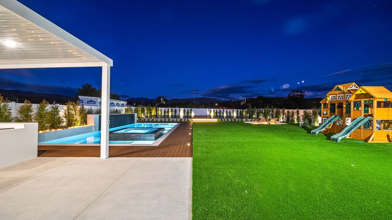 Custom pool and outdoor living project complete with a full court basketball court and outdoor kitchen. Project by Westmod. Location = Santa Clarita, CA.