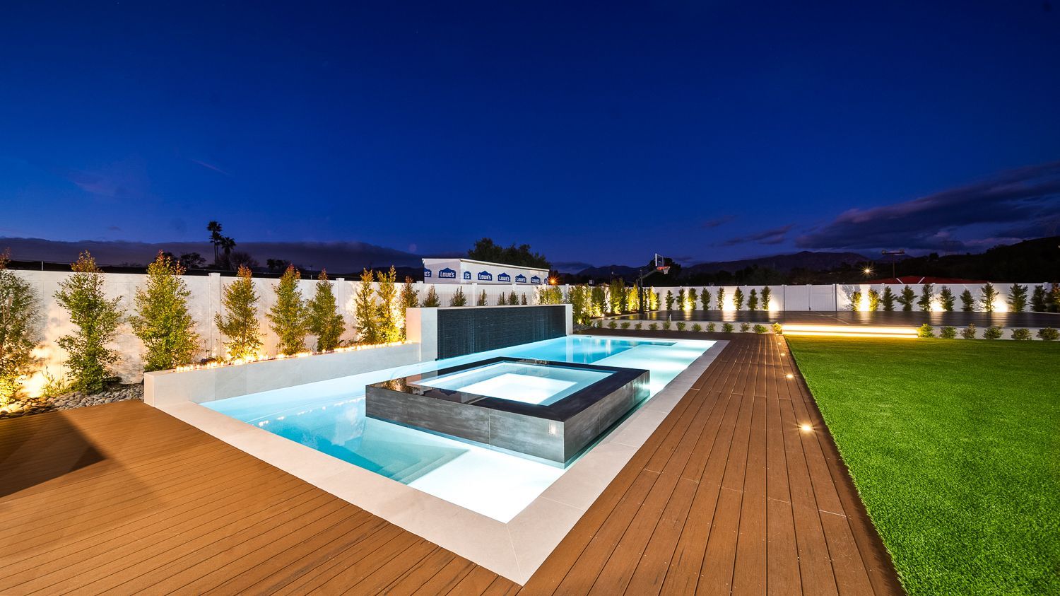 Custom pool and outdoor living project complete with a full court basketball court and outdoor kitchen. Project by Westmod. Location = Santa Clarita, CA.