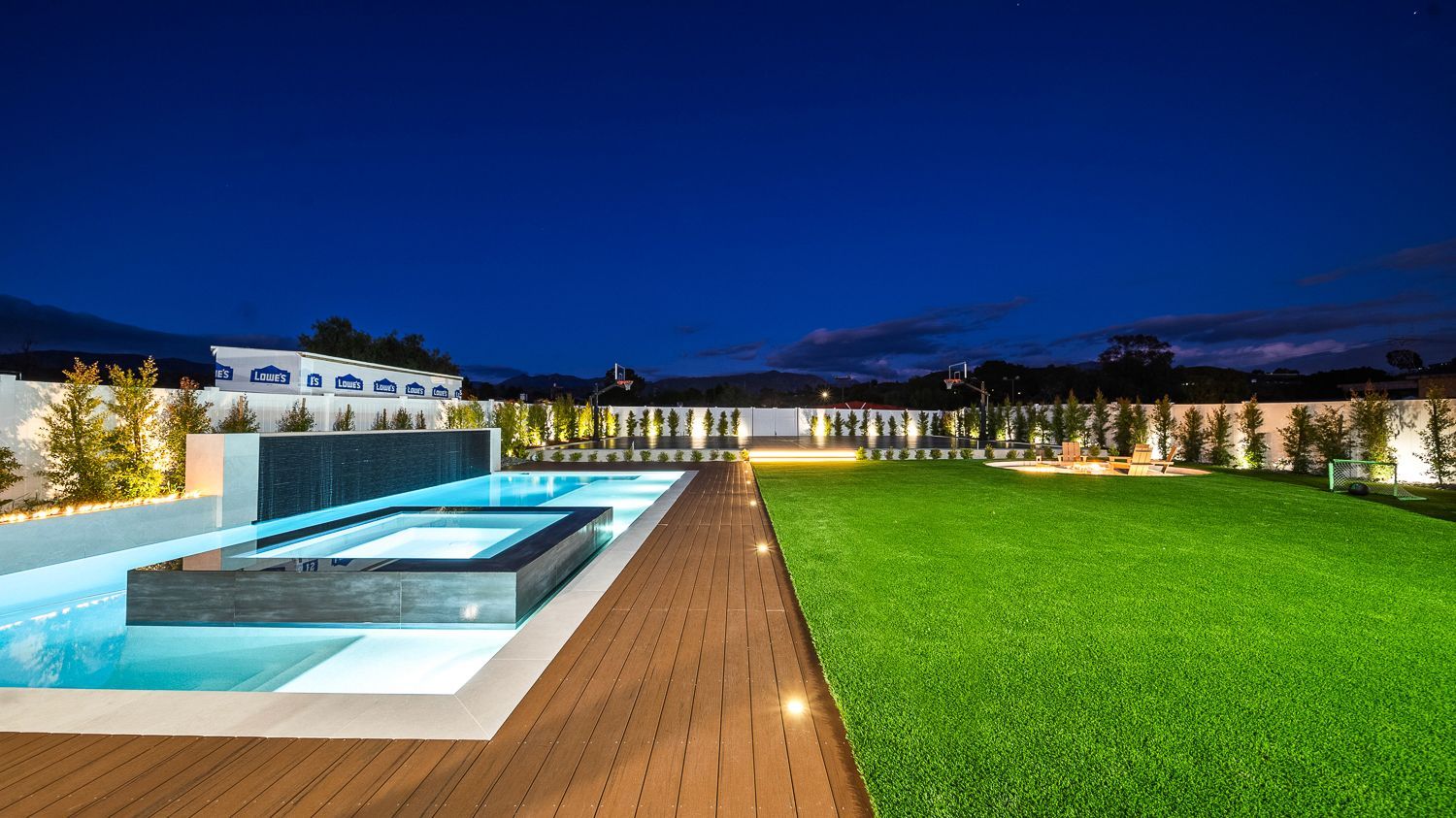 Custom pool and outdoor living project complete with a full court basketball court and outdoor kitchen. Project by Westmod. Location = Santa Clarita, CA.