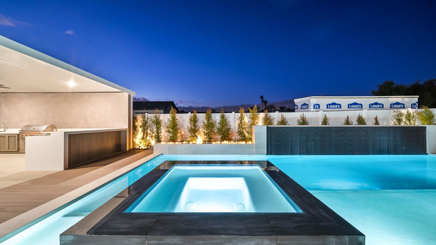 Custom pool and outdoor living project complete with a full court basketball court and outdoor kitchen. Project by Westmod. Location = Santa Clarita, CA.