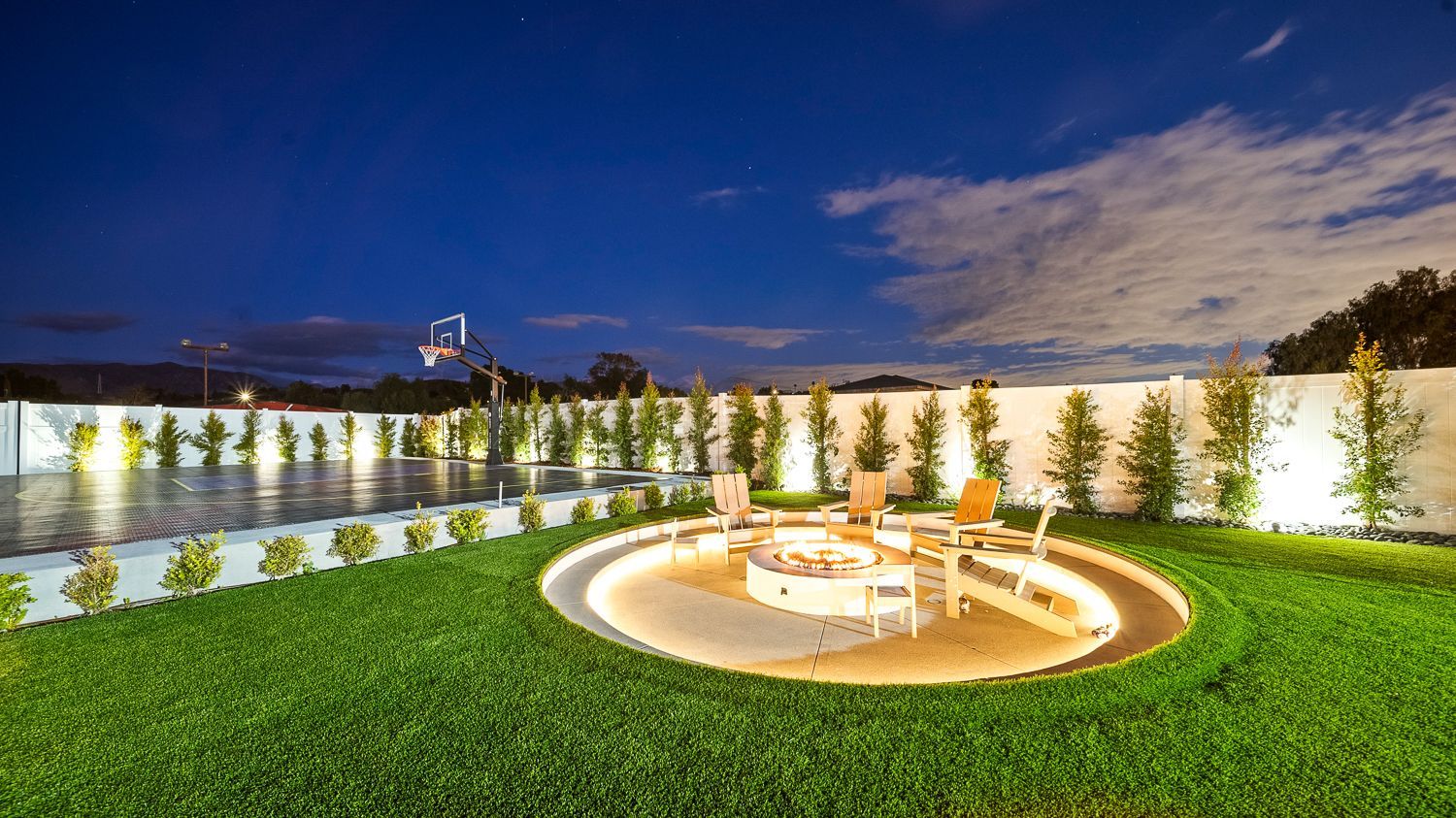 Custom pool and outdoor living project complete with a full court basketball court and outdoor kitchen. Project by Westmod. Location = Santa Clarita, CA.