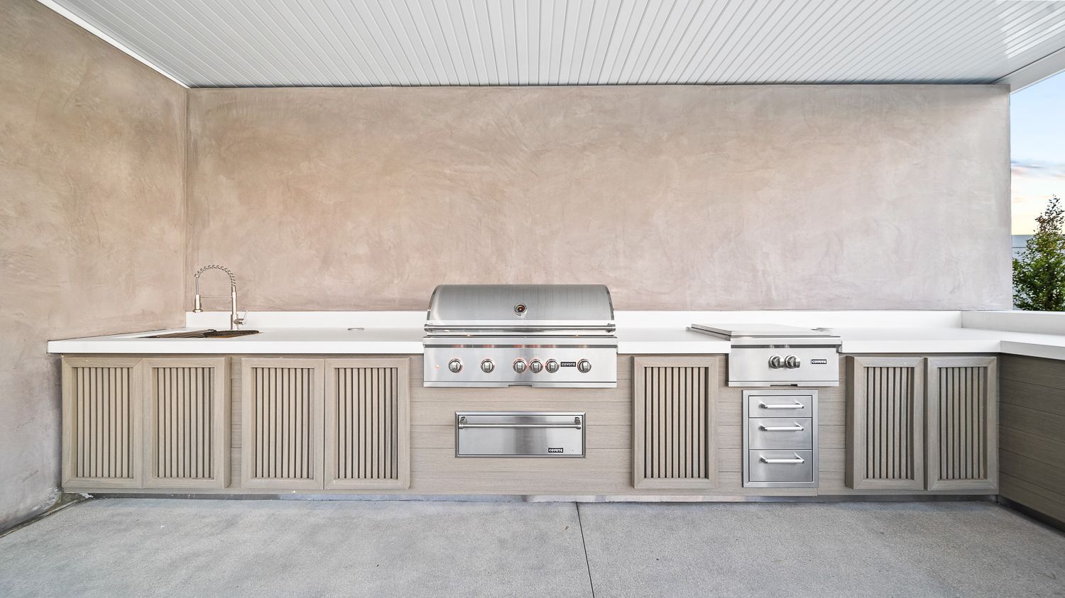 Custom pool and outdoor living project complete with a full court basketball court and outdoor kitchen. Project by Westmod. Location = Santa Clarita, CA.