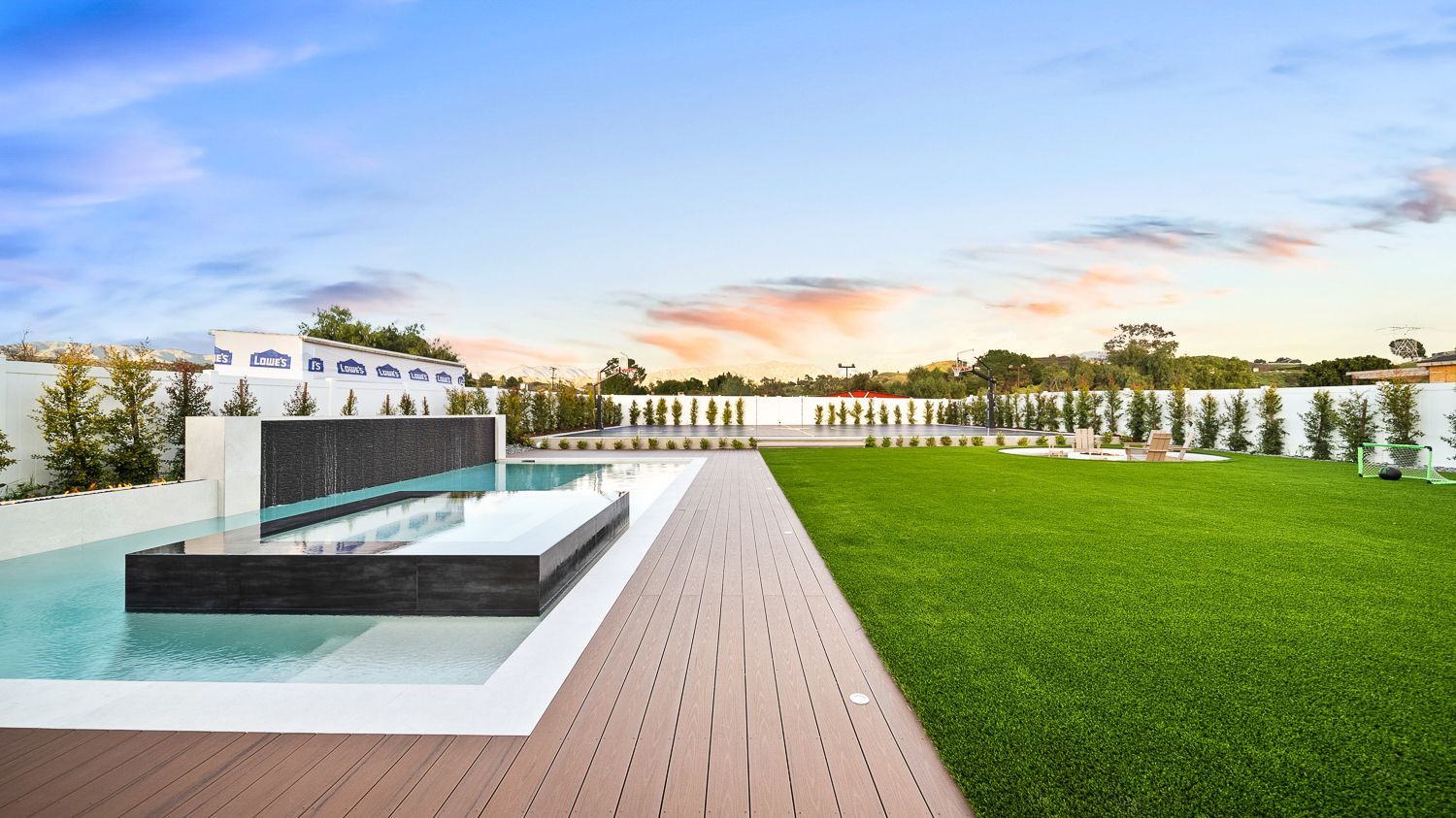 Custom pool and outdoor living project complete with a full court basketball court and outdoor kitchen. Project by Westmod. Location = Santa Clarita, CA.