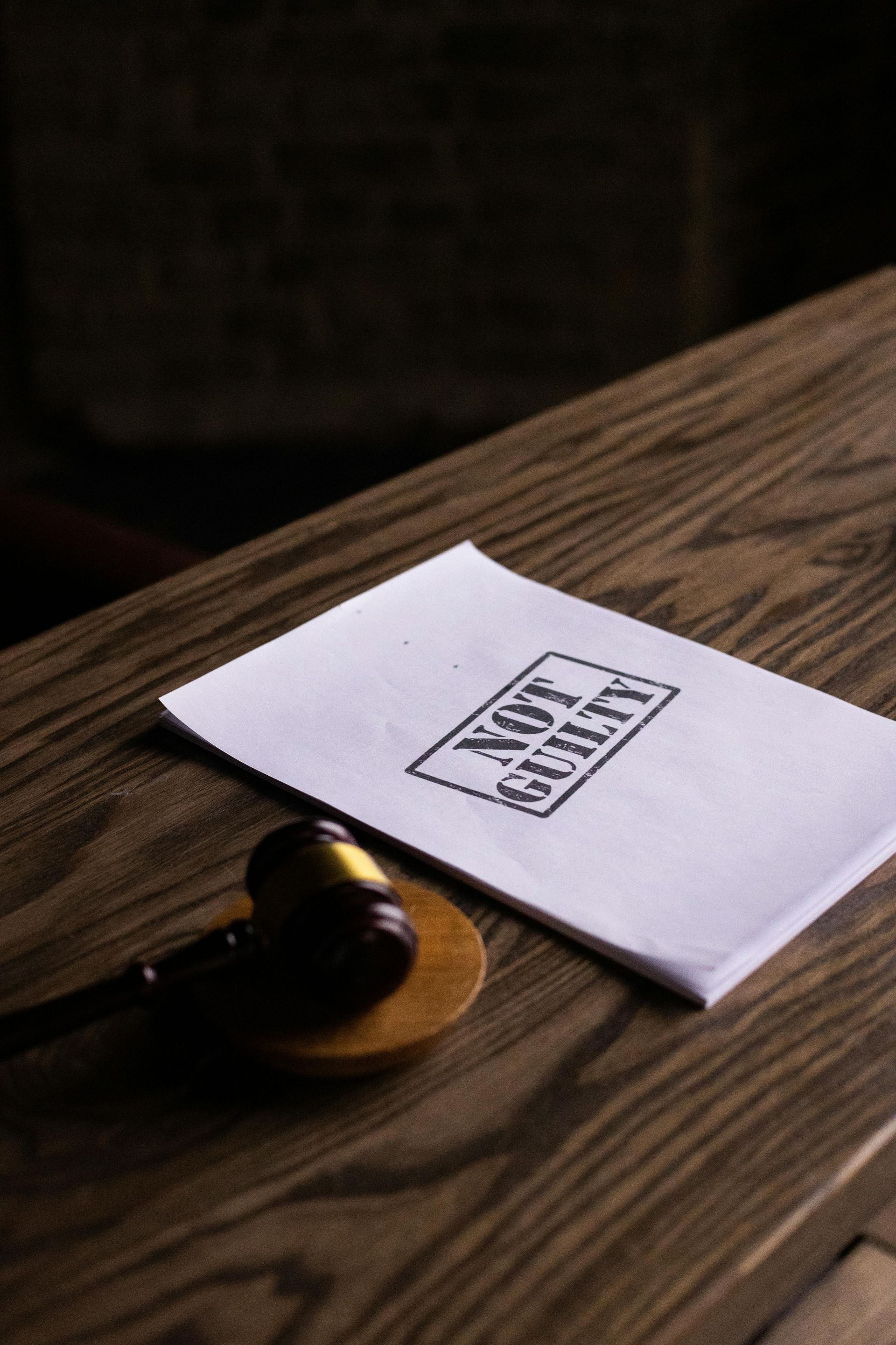 A gavel and a paper stamped