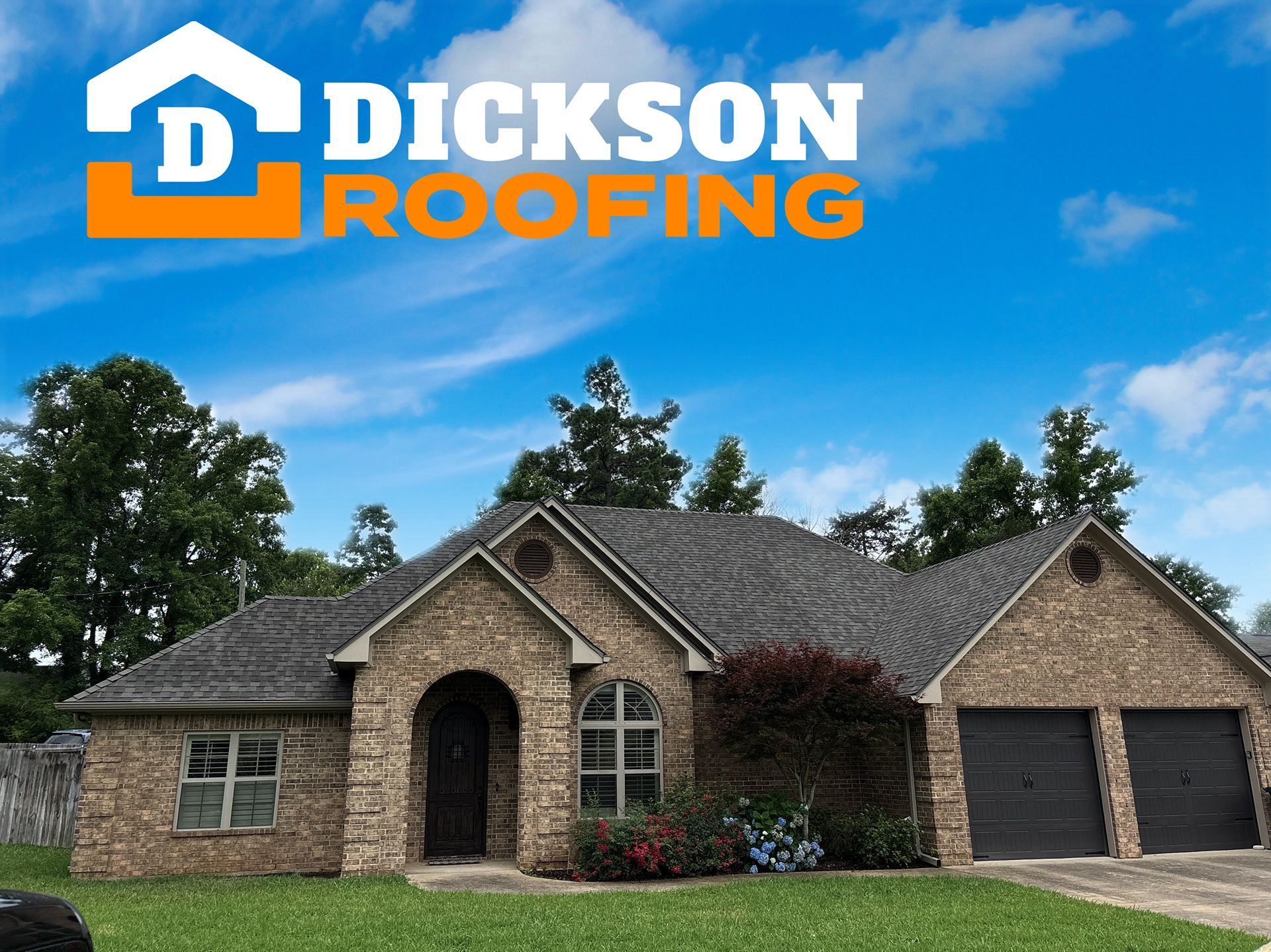Dickson Roofing logo over a brick home with dark shingle roof on a clear day
