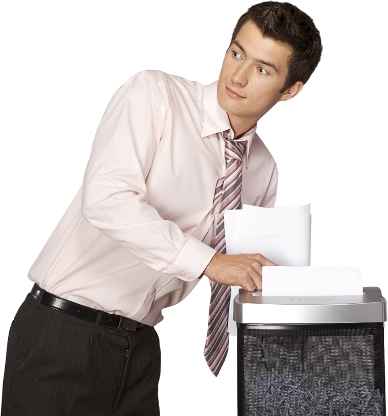 a man in a pink shirt and tie is shredding paper