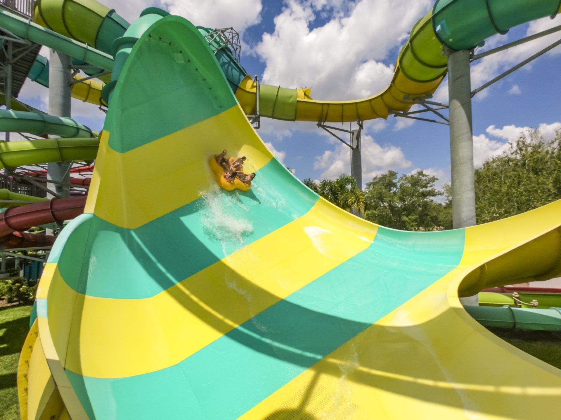 A person is going down a water slide at a water park.