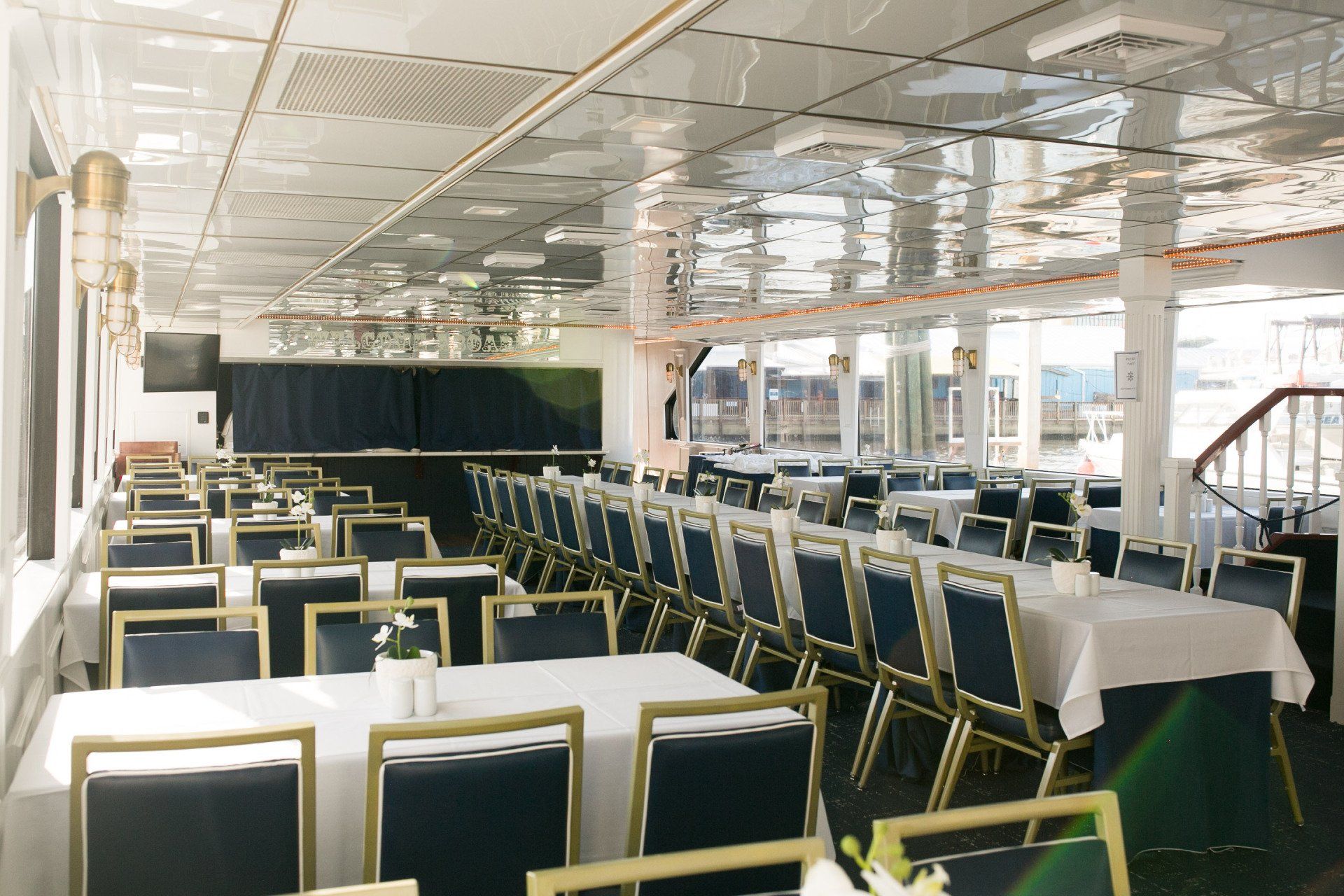 A large room with tables and chairs in it