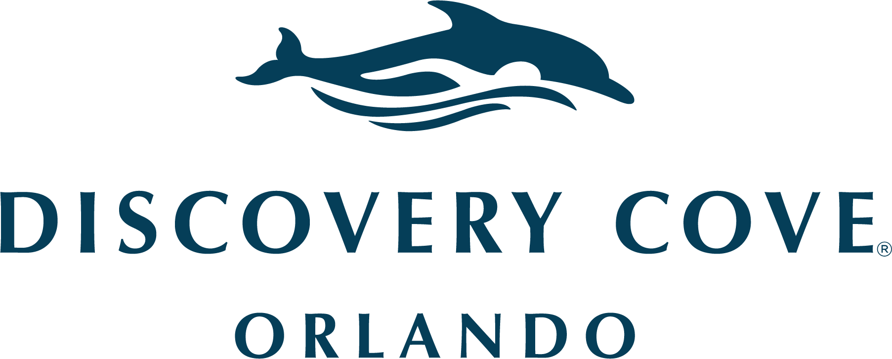The logo for discovery cove orlando shows a dolphin in the water.