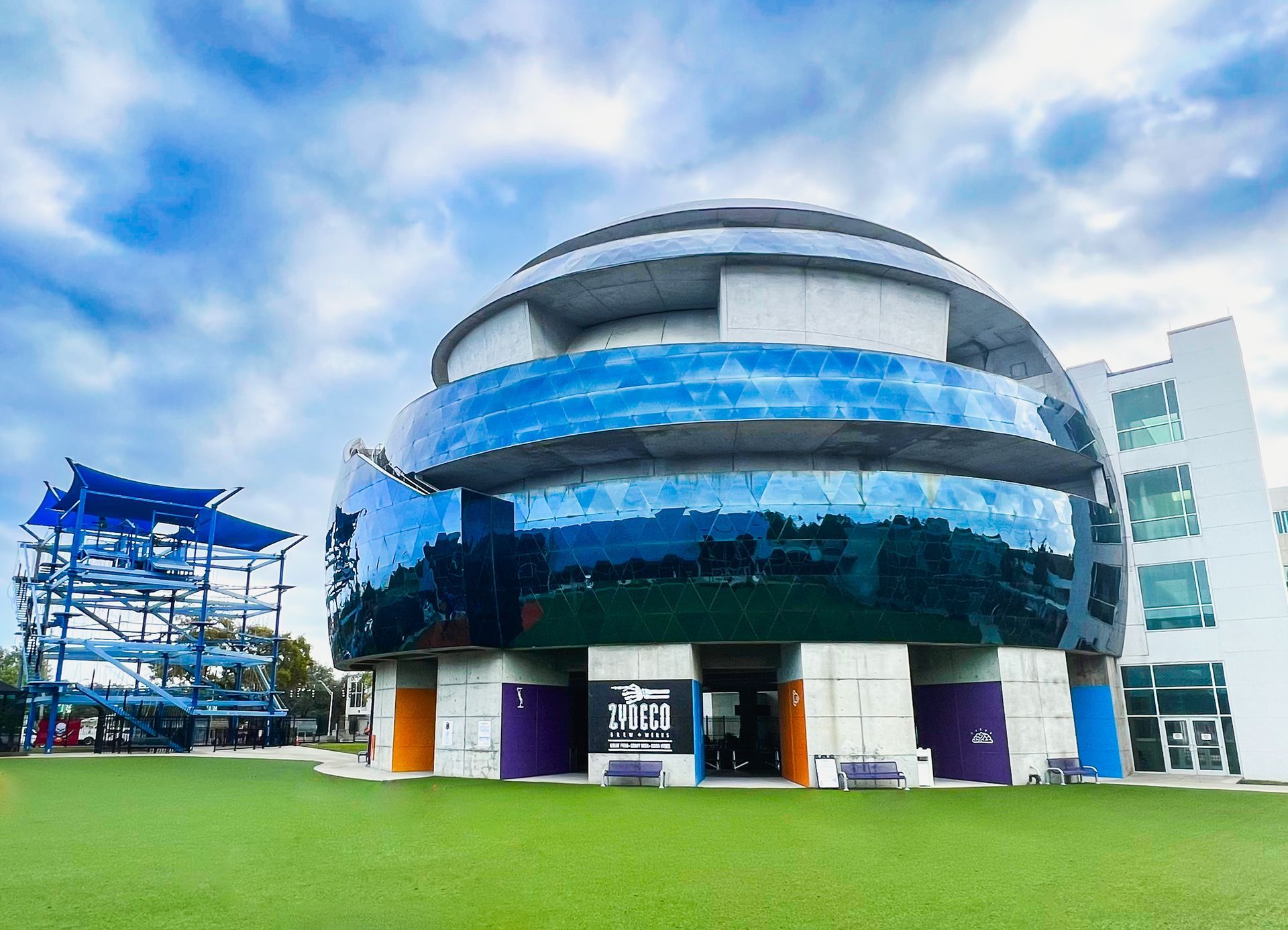 A large building with a blue sky in the background