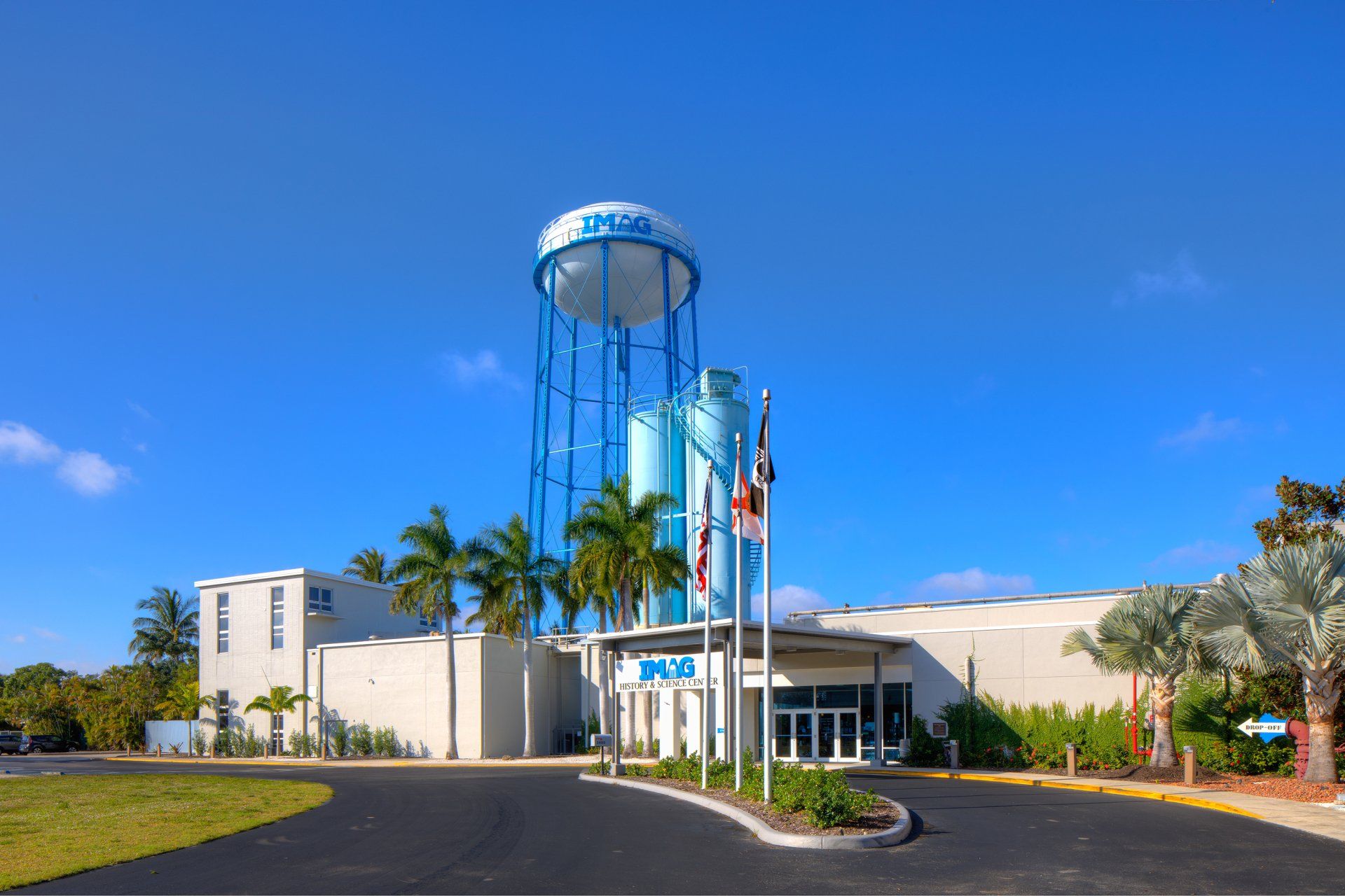 A large building with a water tower in front of it.