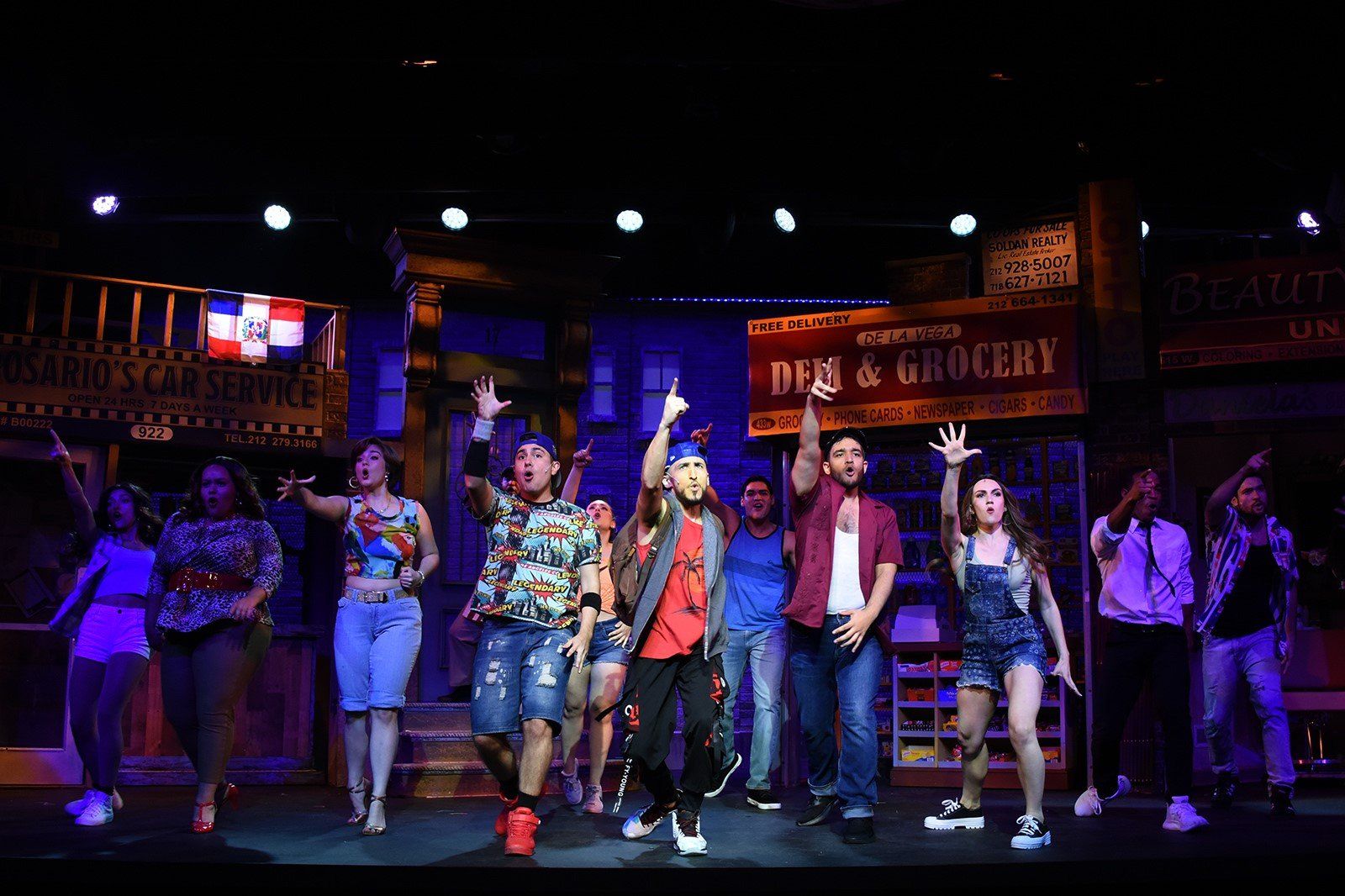 A group of people are dancing on a stage.