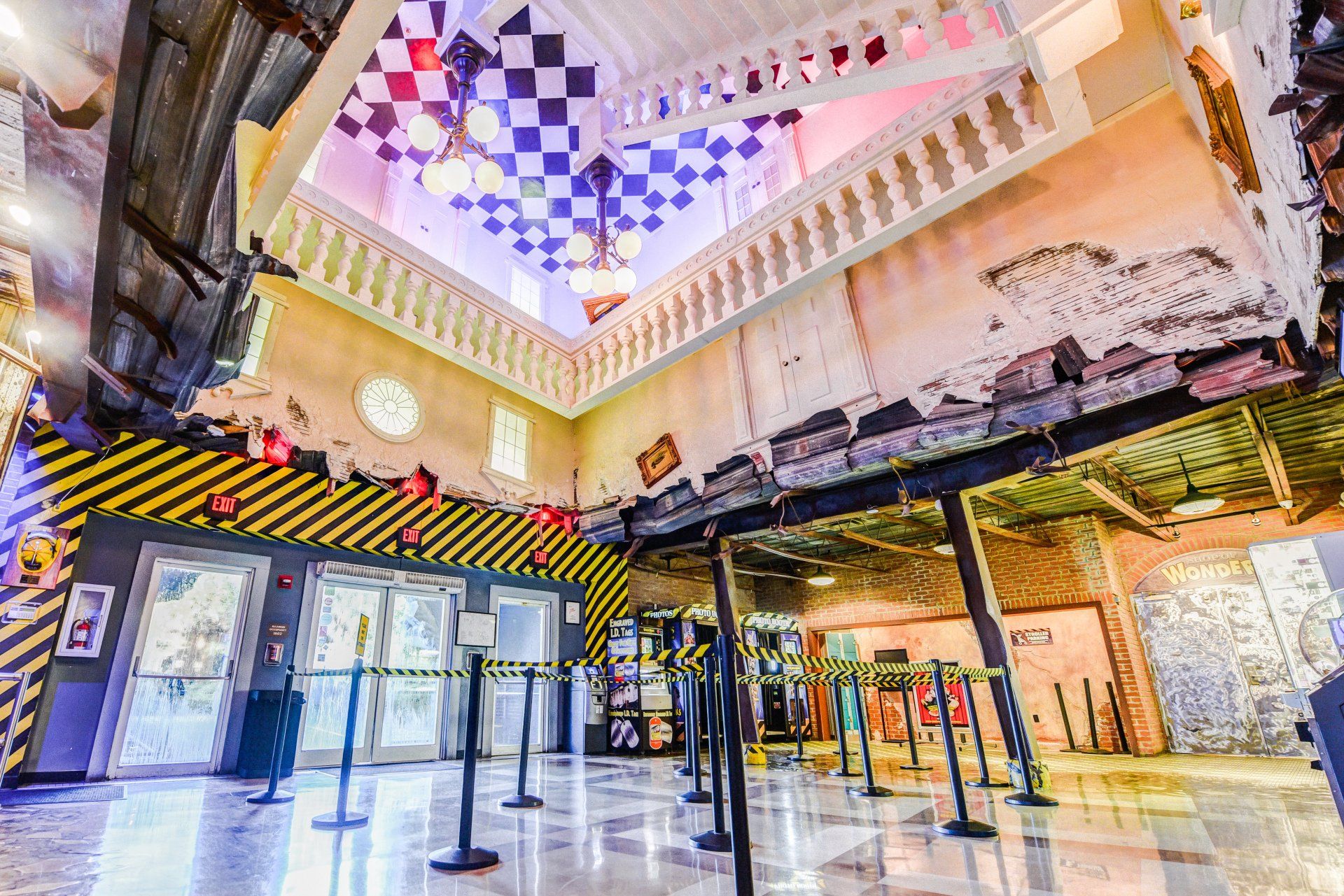 A large room with a ceiling that is upside down and a checkered ceiling.