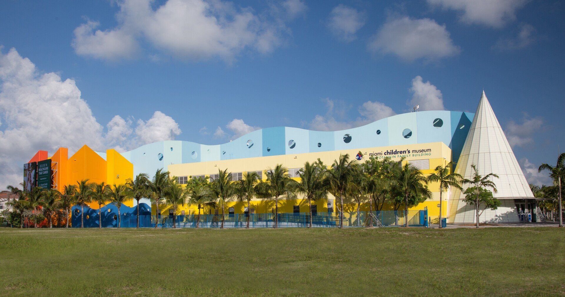 A large building with a sailboat on the side of it