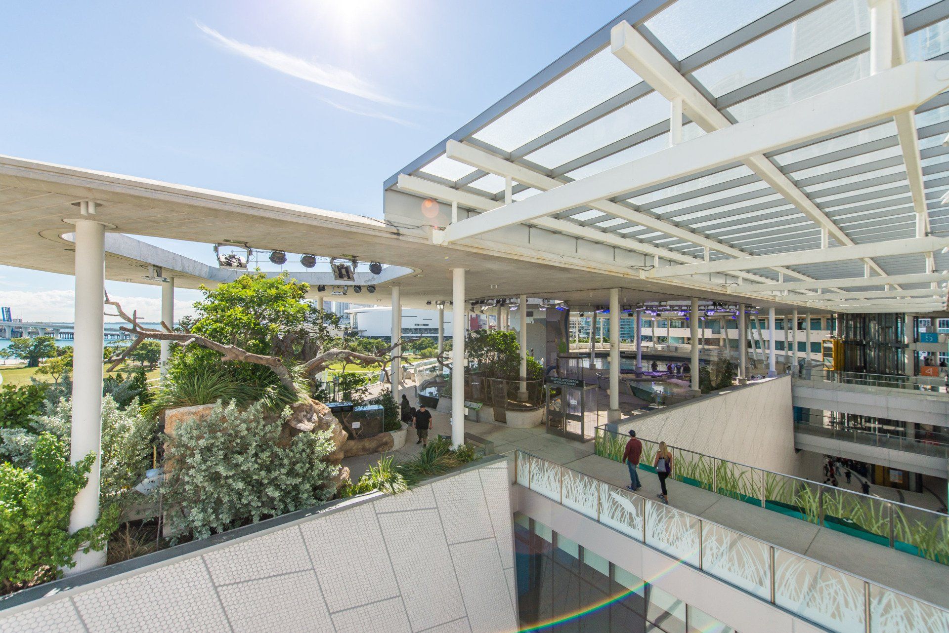 A large building with a roof that is covered in glass.