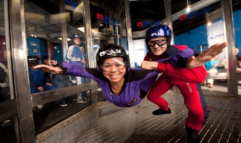 A man and a woman are flying through the air.