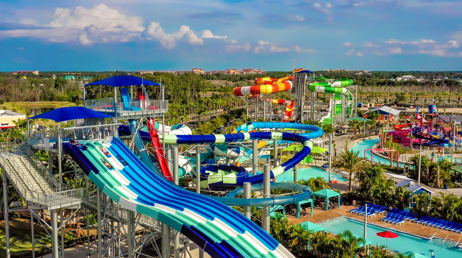 An aerial view of a water park with a lot of water slides.
