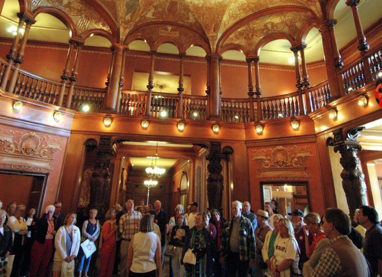 A group of people are standing in a large building