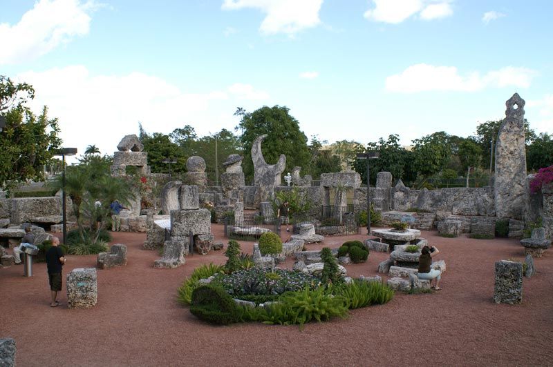 A man stands in the middle of a stone garden