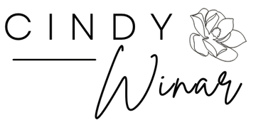 A black and white logo for cindy winar with a flower.