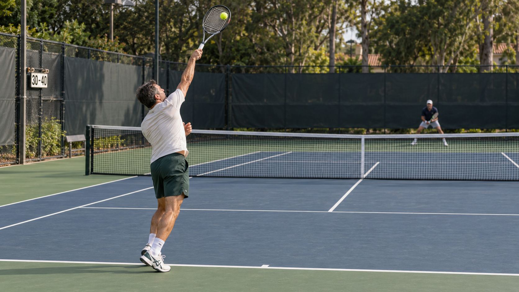 Adult tennis player hitting a second serve during competitive tennis training.