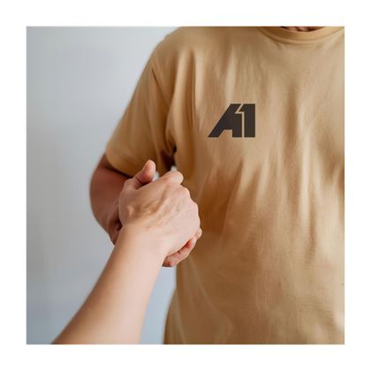 Person in tan shirt with 
